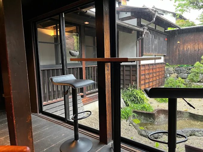 Seating by the window at Sabou Matsushima, overlooking a traditional garden